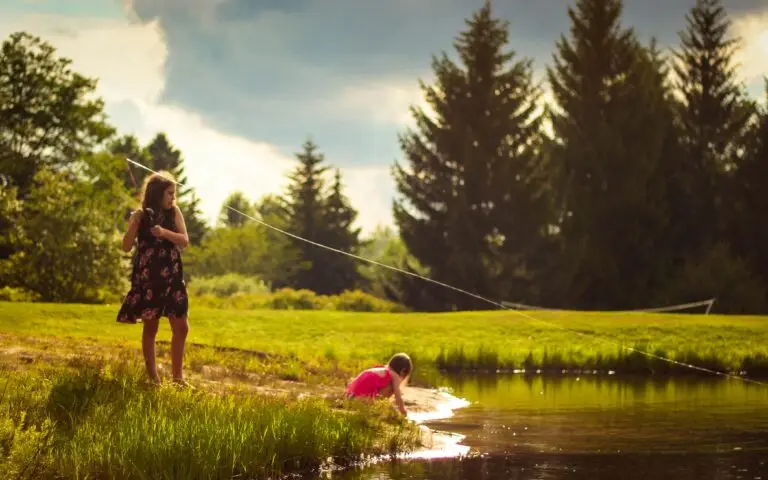 Kids fishing along the river
