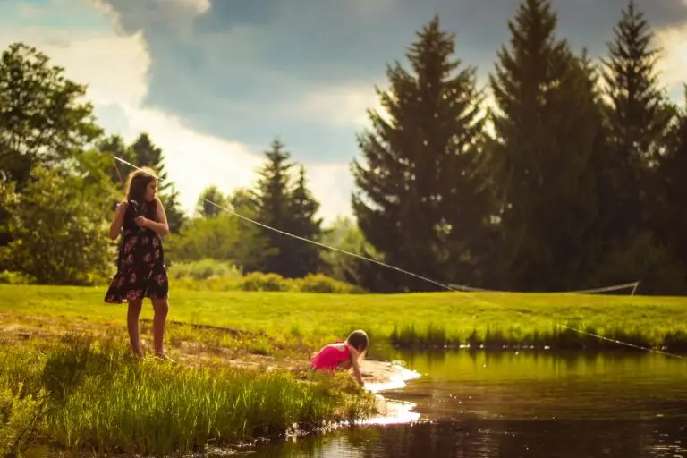 Kids fishing along the river